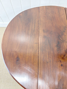 An Antique Cuban Mahogany Drop Leaf Dining Table with Pad Feet