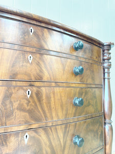 A Large Antique English Bow Front Mahogany Chest of Drawers