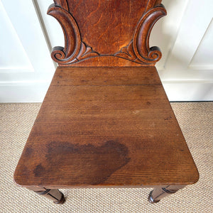 A Pair of Scottish William IV Oak Carved Hall Chairs