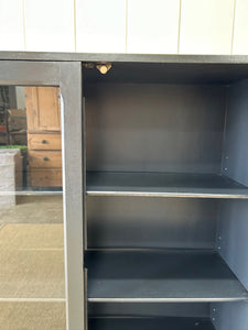 A Pair of English Teak Ebonized Bookcases