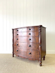 A Large Antique English Bow Front Mahogany Chest of Drawers