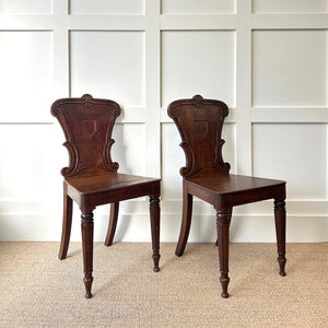 A Pair of Scottish William IV Oak Carved Hall Chairs