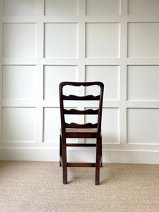 An 18th Century Oak Rush Seated Ladderback Side Chair