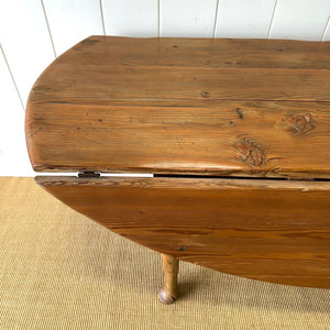 An Antique Irish Pine Oval Drop Leaf Kitchen Dining Table with Spoon Feet