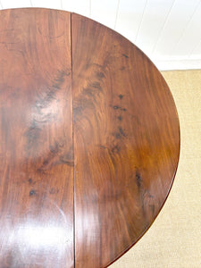 An Antique Cuban Mahogany Drop Leaf Dining Table with Pad Feet