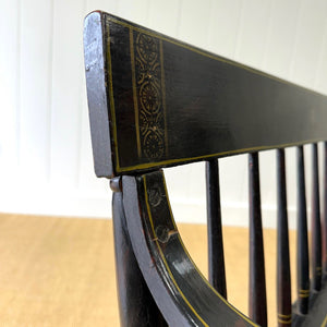 An Antique Ebonized Bench