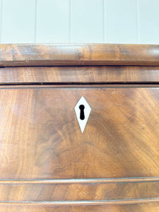 A Large Antique English Bow Front Mahogany Chest of Drawers