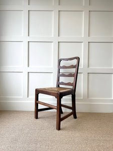 An 18th Century Oak Rush Seated Ladderback Side Chair