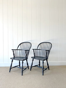 A Set of Four Black Windsor Armchairs