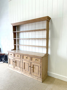 An Early 19th Century Monumental Pine Welsh Dresser or Cupboard