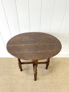 An Antique English Country Oak Coaching Gate Leg Table