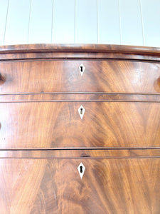 A Large Antique English Bow Front Mahogany Chest of Drawers