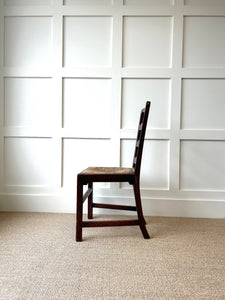 An 18th Century Oak Rush Seated Ladderback Side Chair