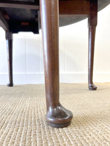 An Antique Cuban Mahogany Drop Leaf Dining Table with Pad Feet