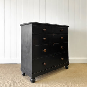 An Ebonized Antique English Chest of Drawers/Dresser