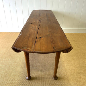 An Antique Irish Pine Oval Drop Leaf Kitchen Dining Table with Spoon Feet