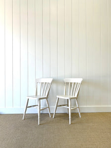 A Vintage Set of 4 White Slat Back Chairs