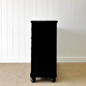 An Ebonized Antique English Chest of Drawers/Dresser