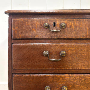 A English Georgian Chest of Drawers with Swan Neck Hardware