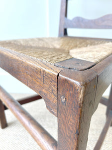 An 18th Century Oak Rush Seated Ladderback Side Chair