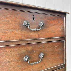 A English Georgian Chest of Drawers with Swan Neck Hardware