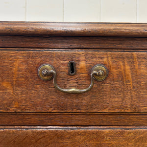 A English Georgian Chest of Drawers with Swan Neck Hardware