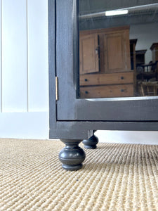 A Pair of English Teak Ebonized Bookcases