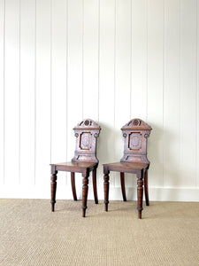 A Pair of English Oak Carved Hall Chairs