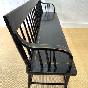 An Antique Ebonized Bench