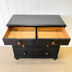 An Ebonized Antique English Chest of Drawers/Dresser