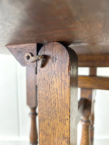 An Antique English Country Oak Coaching Gate Leg Table