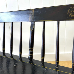 An Antique Ebonized Bench