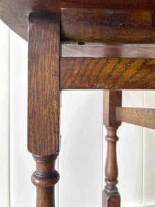 An Antique English Country Oak Coaching Gate Leg Table