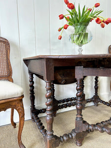 An Antique English Country Oak Drop Leaf Gate Leg Table