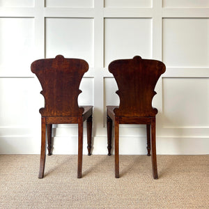 A Pair of Scottish William IV Oak Carved Hall Chairs