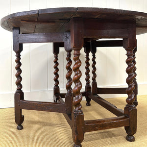 An Antique English Country Barley Twist Oak Drop Leaf Gate Leg Table