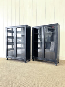 A Pair of English Teak Ebonized Bookcases