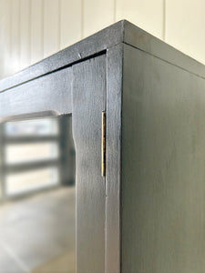 A Pair of English Teak Ebonized Bookcases