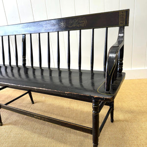 An Antique Ebonized Bench