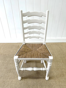 A Set of 4 Ladderback Rush Seat Chairs Painted White