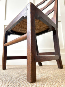 An 18th Century Oak Rush Seated Ladderback Side Chair