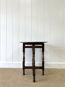 An Antique English Country Oak Coaching Gate Leg Table