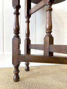 An Antique English Country Oak Coaching Gate Leg Table