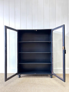 A Pair of English Teak Ebonized Bookcases