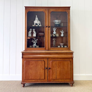 A 19th Century English Pine Bookcase with Glazed Top Doors