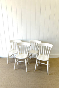 A Vintage Set of 4 White Slat Back Chairs