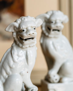 A Pair of Chinese Blanc de Chine Figures of Foo Dogs