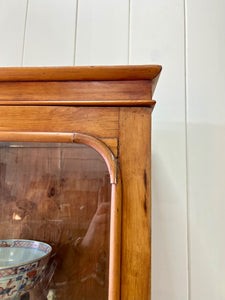 A 19th Century English Pine Bookcase with Glazed Top Doors