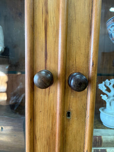 A 19th Century English Pine Bookcase with Glazed Top Doors