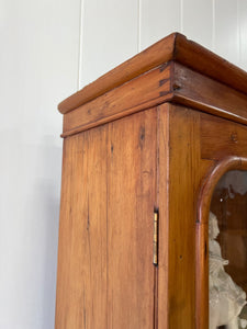 A 19th Century English Pine Bookcase with Glazed Top Doors